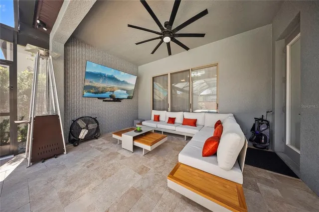 a view of a backyard with table and chairs with wooden fence