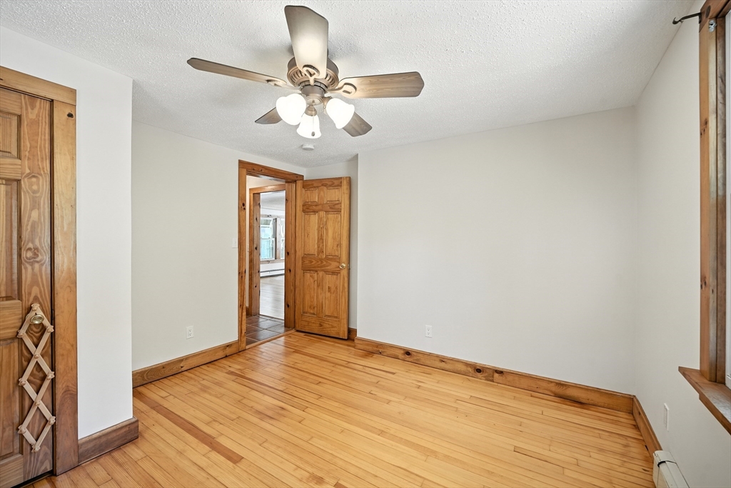61 West Street Ludlow, MA 01056 - Photo 12 of 29 a view of empty room with wooden floor and fan