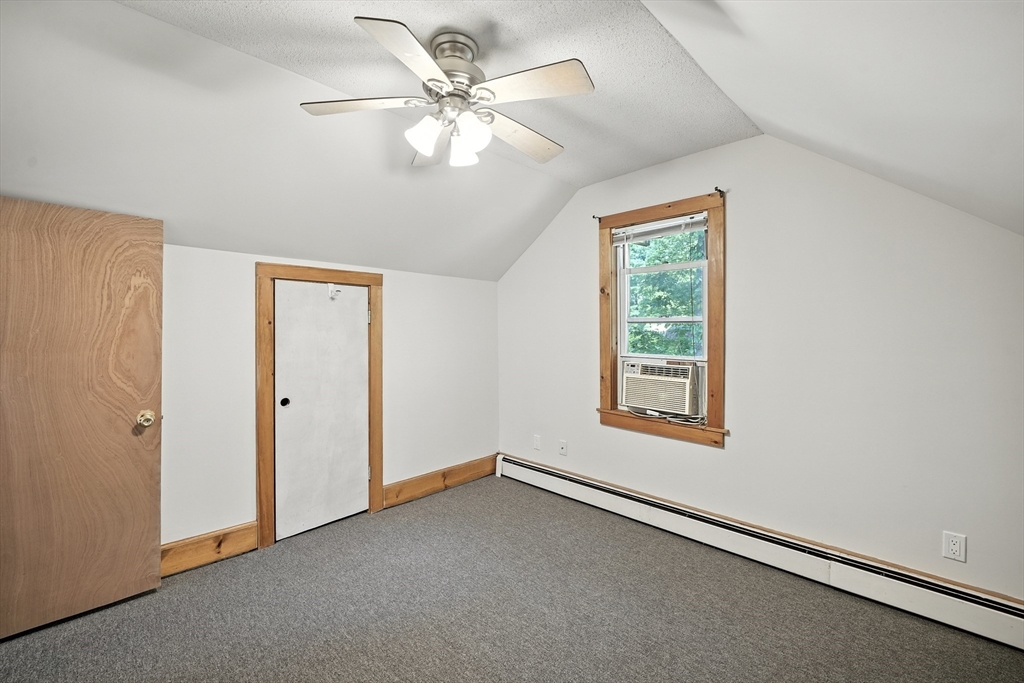 61 West Street Ludlow, MA 01056 - Photo 14 of 29 an empty room with windows and fan