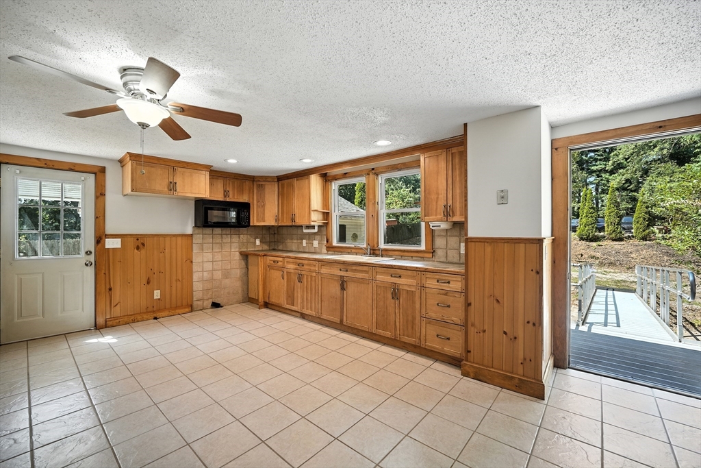 61 West Street Ludlow, MA 01056 - Photo 2 of 29 a kitchen with stainless steel appliances granite countertop a stove and a refrigerator