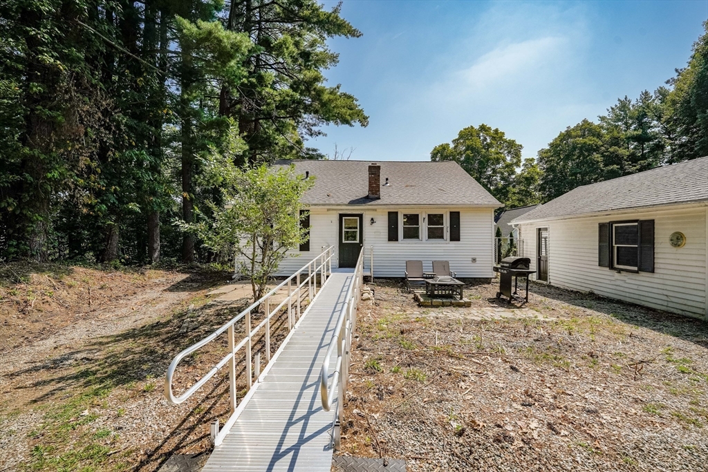 61 West Street Ludlow, MA 01056 - Photo 28 of 29 a house with trees in the background