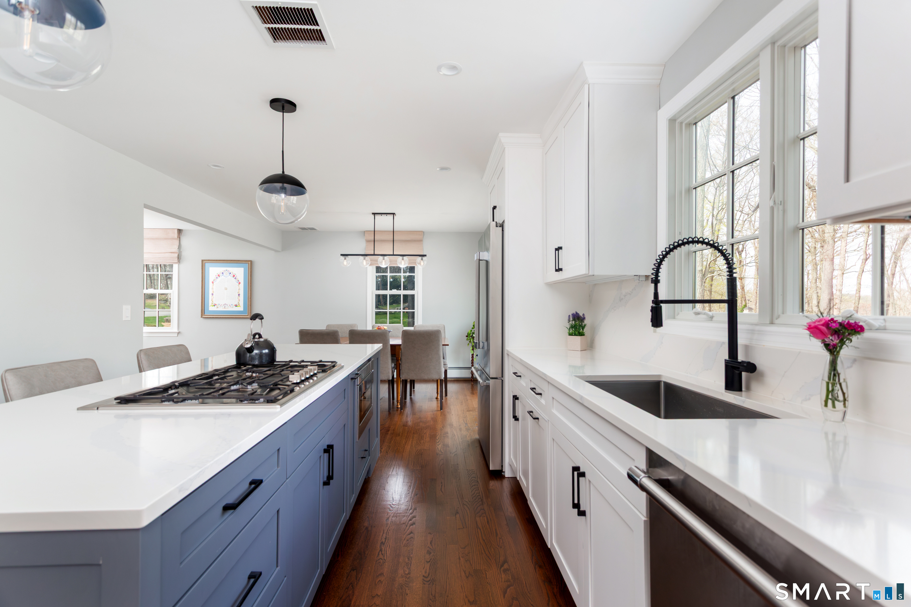 33 Cardinal Road Weston, CT 06883 - Photo 11 of 38 a kitchen with stainless steel appliances a sink a stove and a window