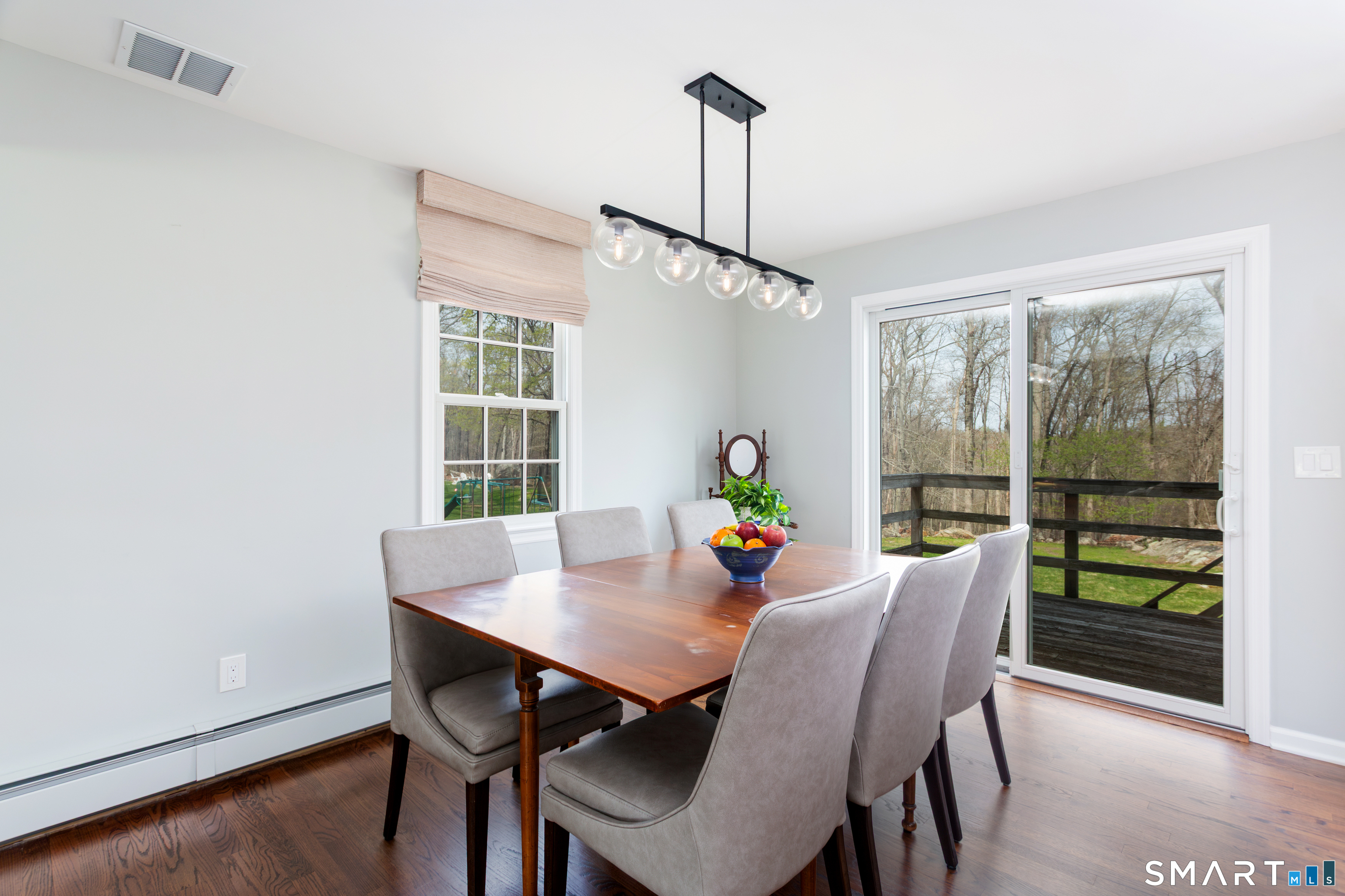 33 Cardinal Road Weston, CT 06883 - Photo 16 of 38 a view of a dining room with furniture window and outside view