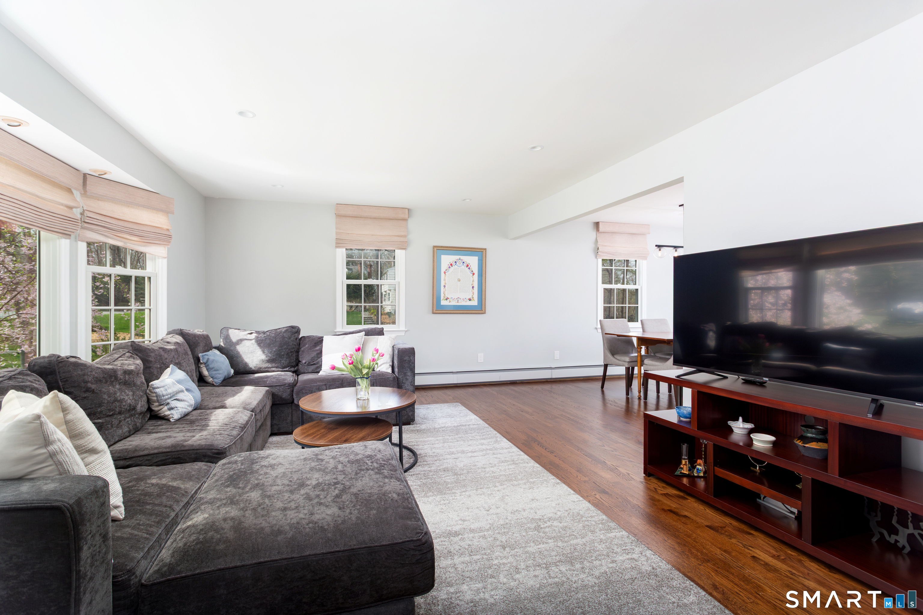 33 Cardinal Road Weston, CT 06883 - Photo 22 of 38 a living room with furniture and a flat screen tv