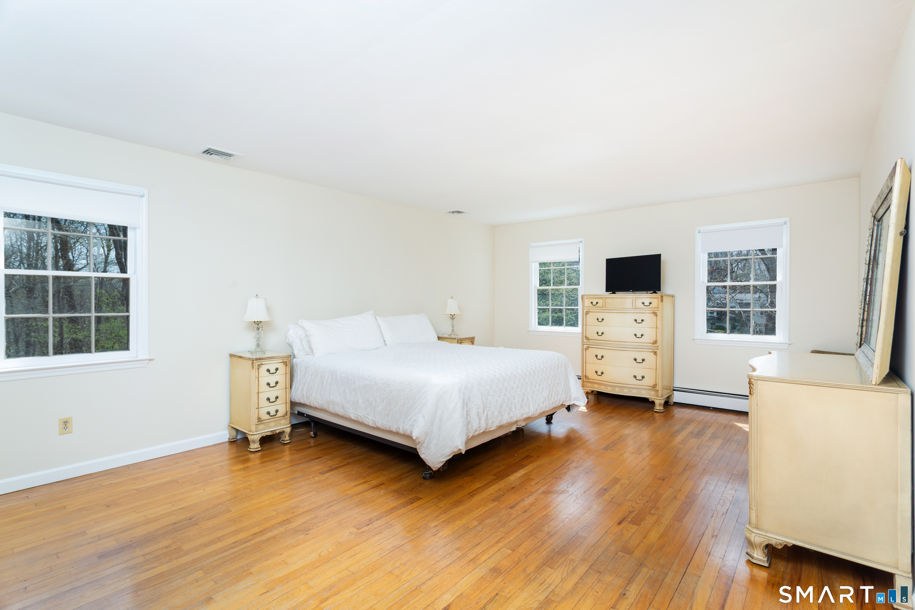 33 Cardinal Road Weston, CT 06883 - Photo 23 of 38 a bedroom with a bed and a view of kitchen