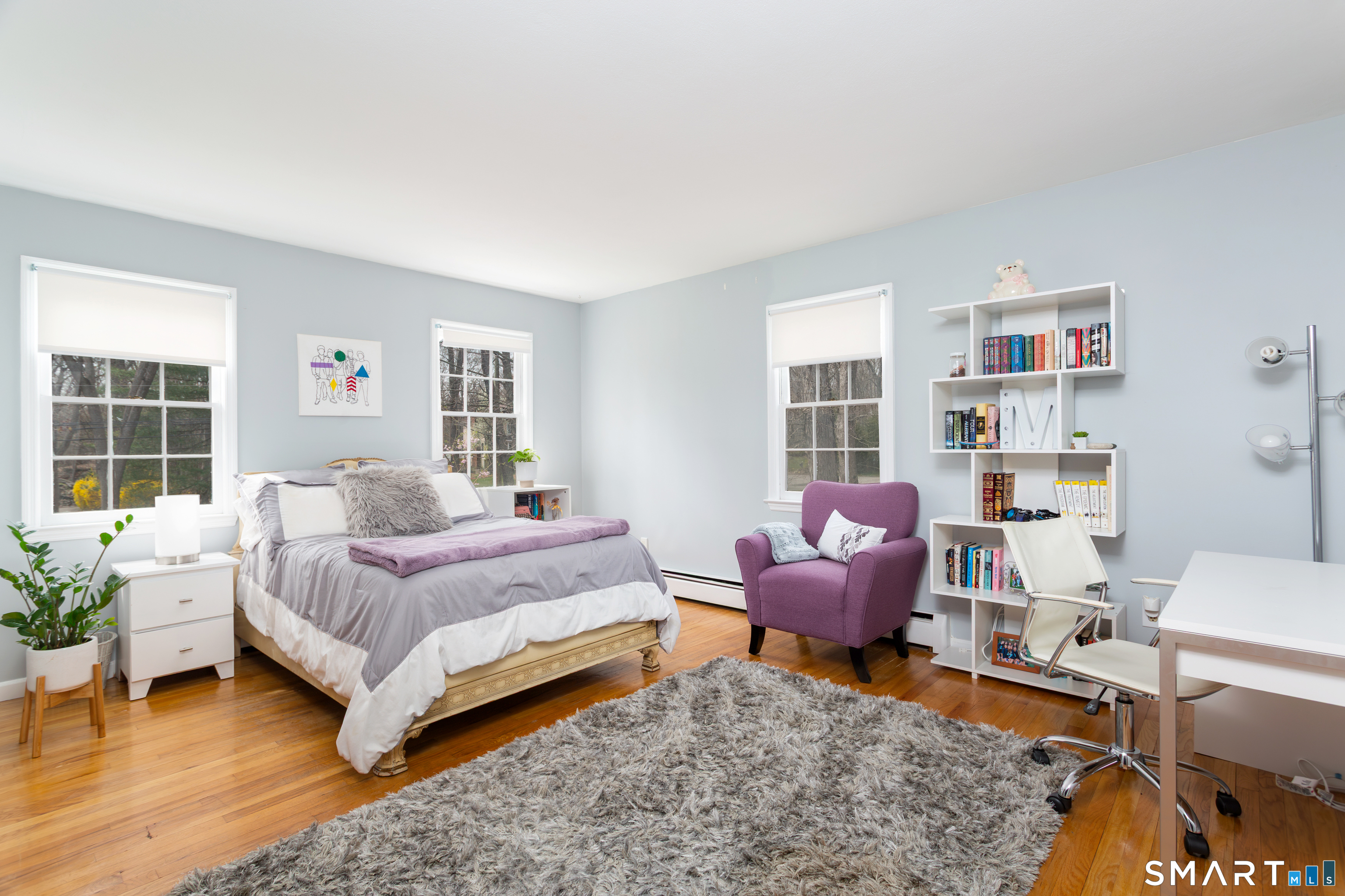 33 Cardinal Road Weston, CT 06883 - Photo 24 of 38 a bedroom with a bed and wooden floor