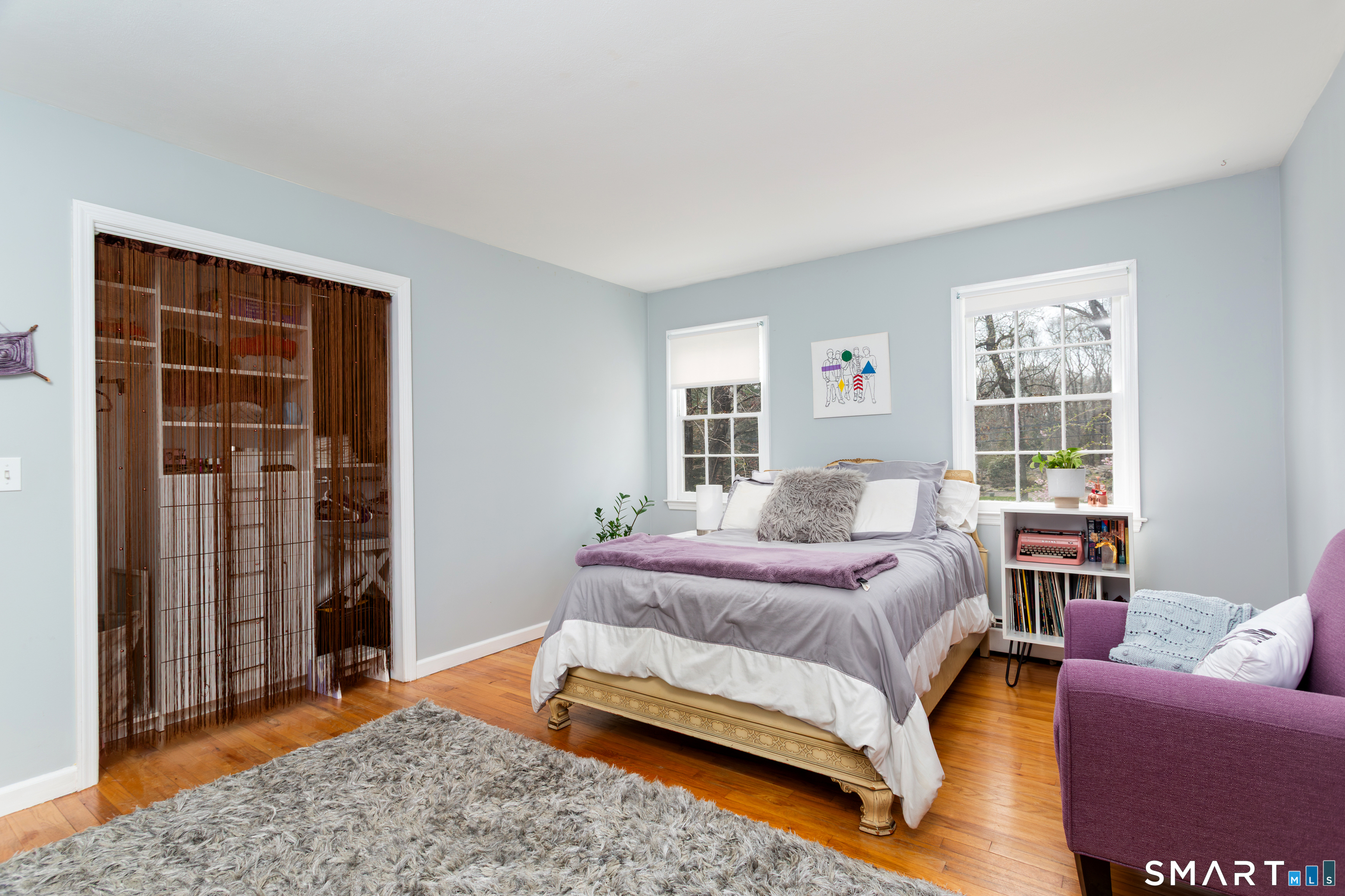 33 Cardinal Road Weston, CT 06883 - Photo 25 of 38 a bedroom with a bed and a couch