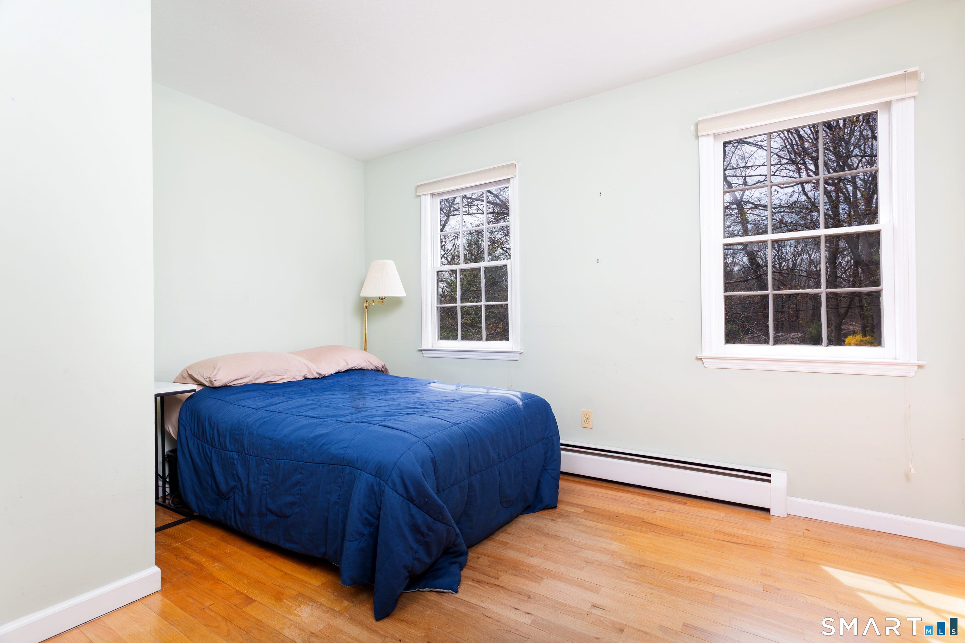 33 Cardinal Road Weston, CT 06883 - Photo 26 of 38 a bedroom with a bed and a window