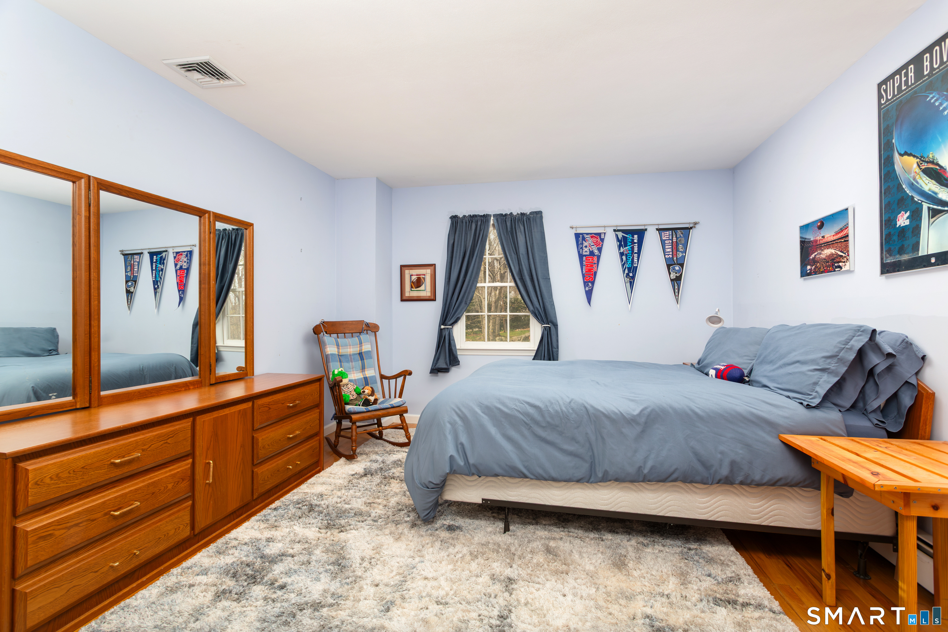 33 Cardinal Road Weston, CT 06883 - Photo 27 of 38 a bedroom with a bed and dresser