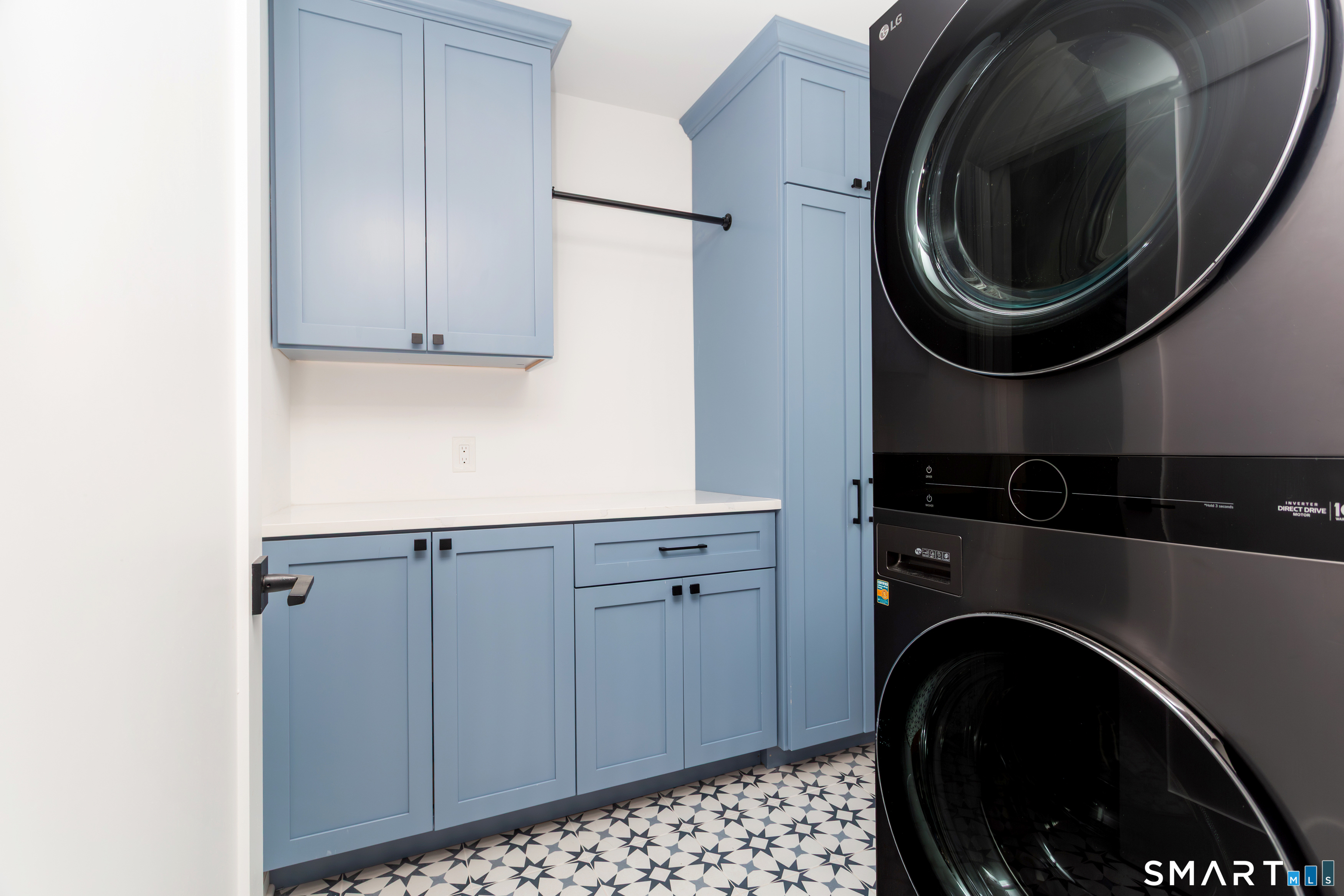 33 Cardinal Road Weston, CT 06883 - Photo 31 of 38 a utility room with sink dryer and washer
