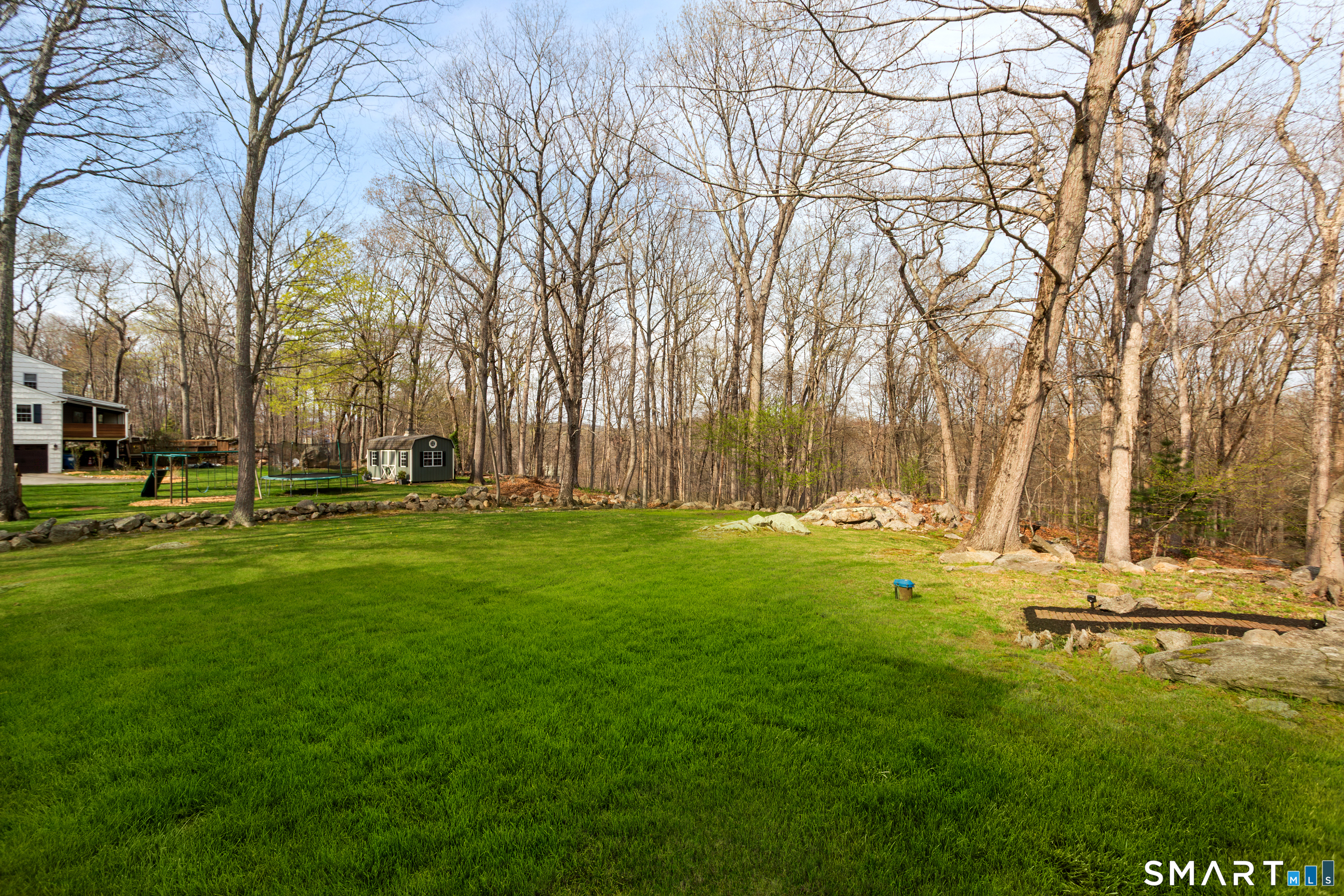 33 Cardinal Road Weston, CT 06883 - Photo 34 of 38 a view of backyard with tree