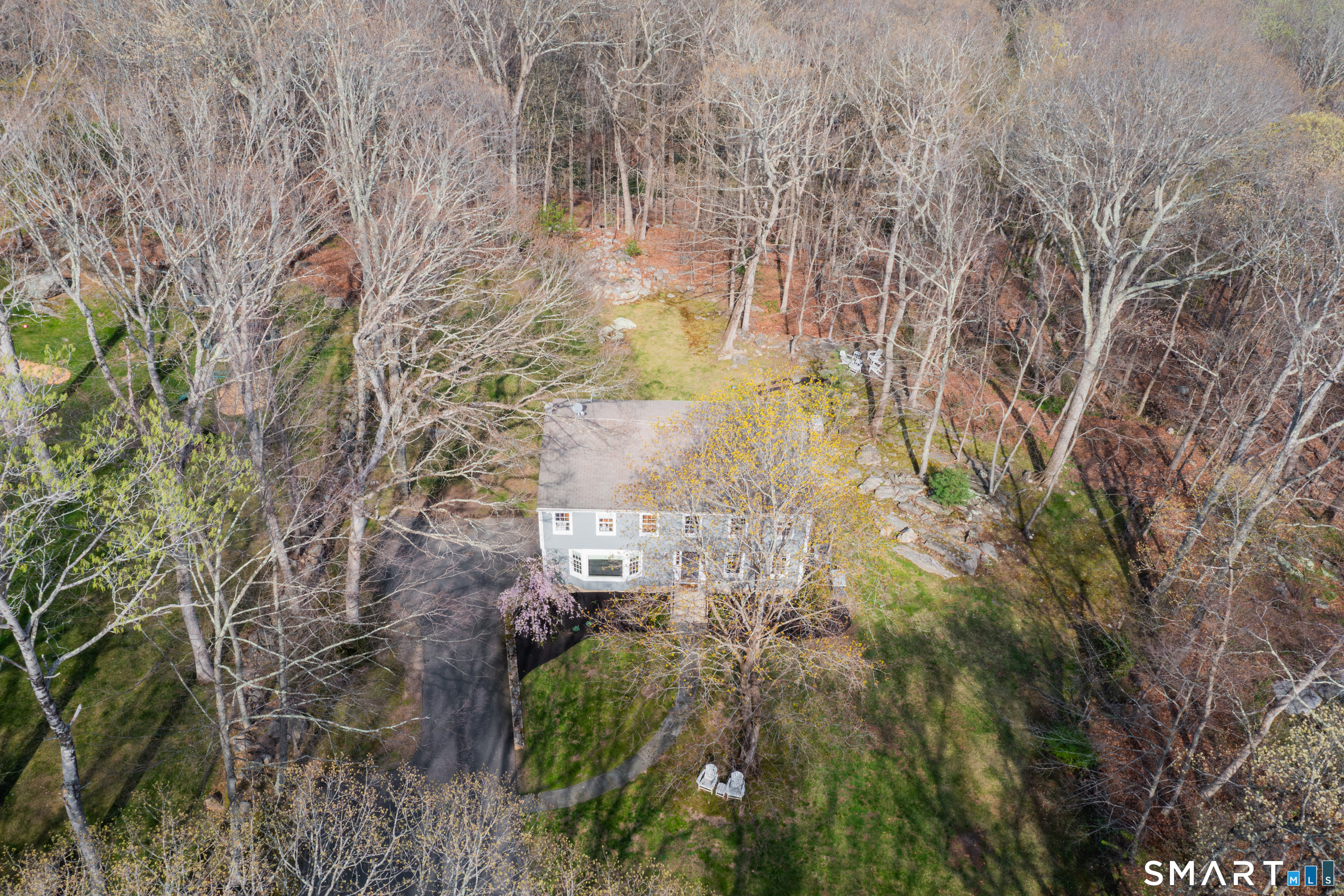 33 Cardinal Road Weston, CT 06883 - Photo 37 of 38 a aerial view of a residential houses with yard