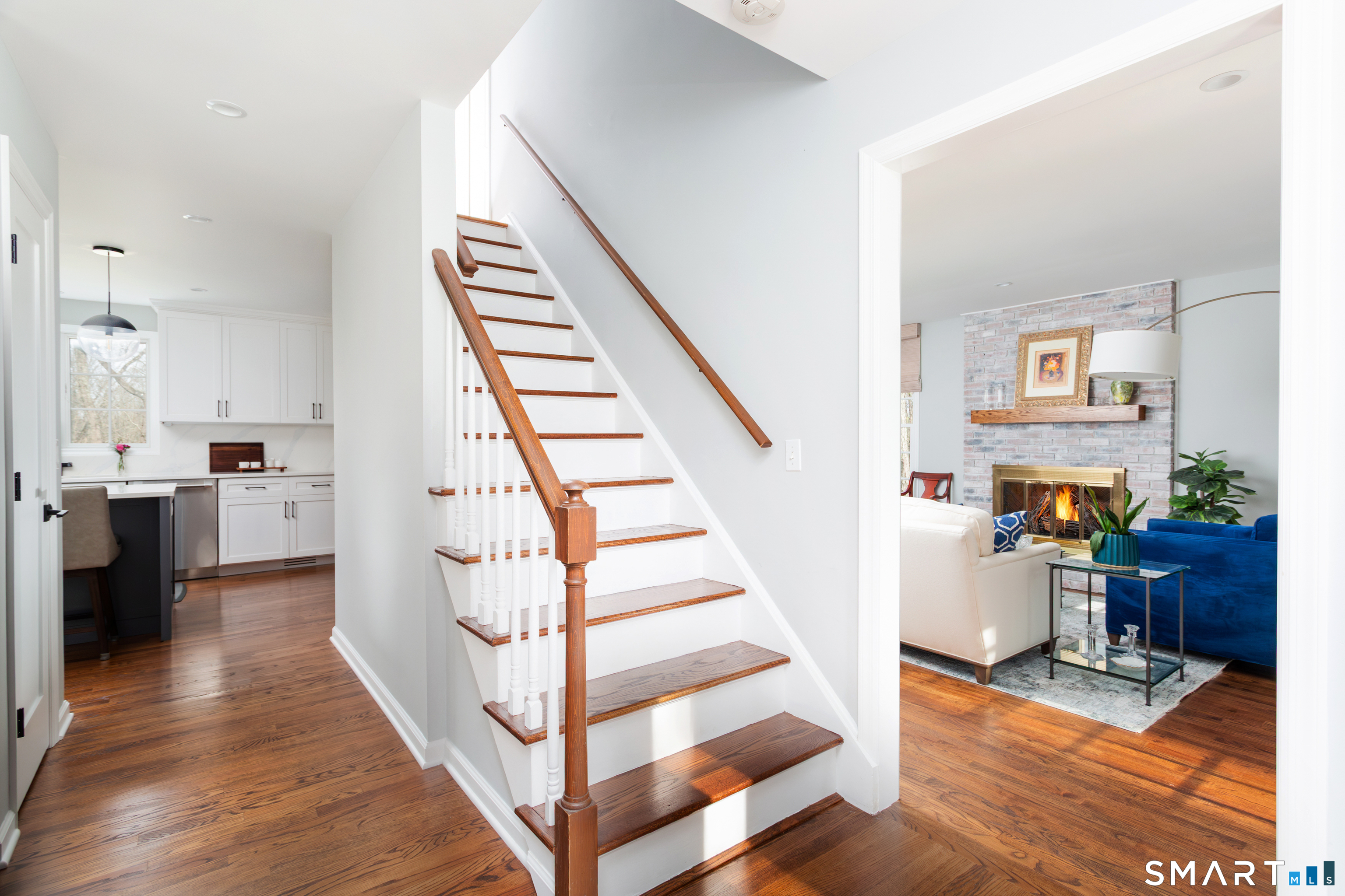 33 Cardinal Road Weston, CT 06883 - Photo 4 of 38 a view of entryway and hall with wooden floor