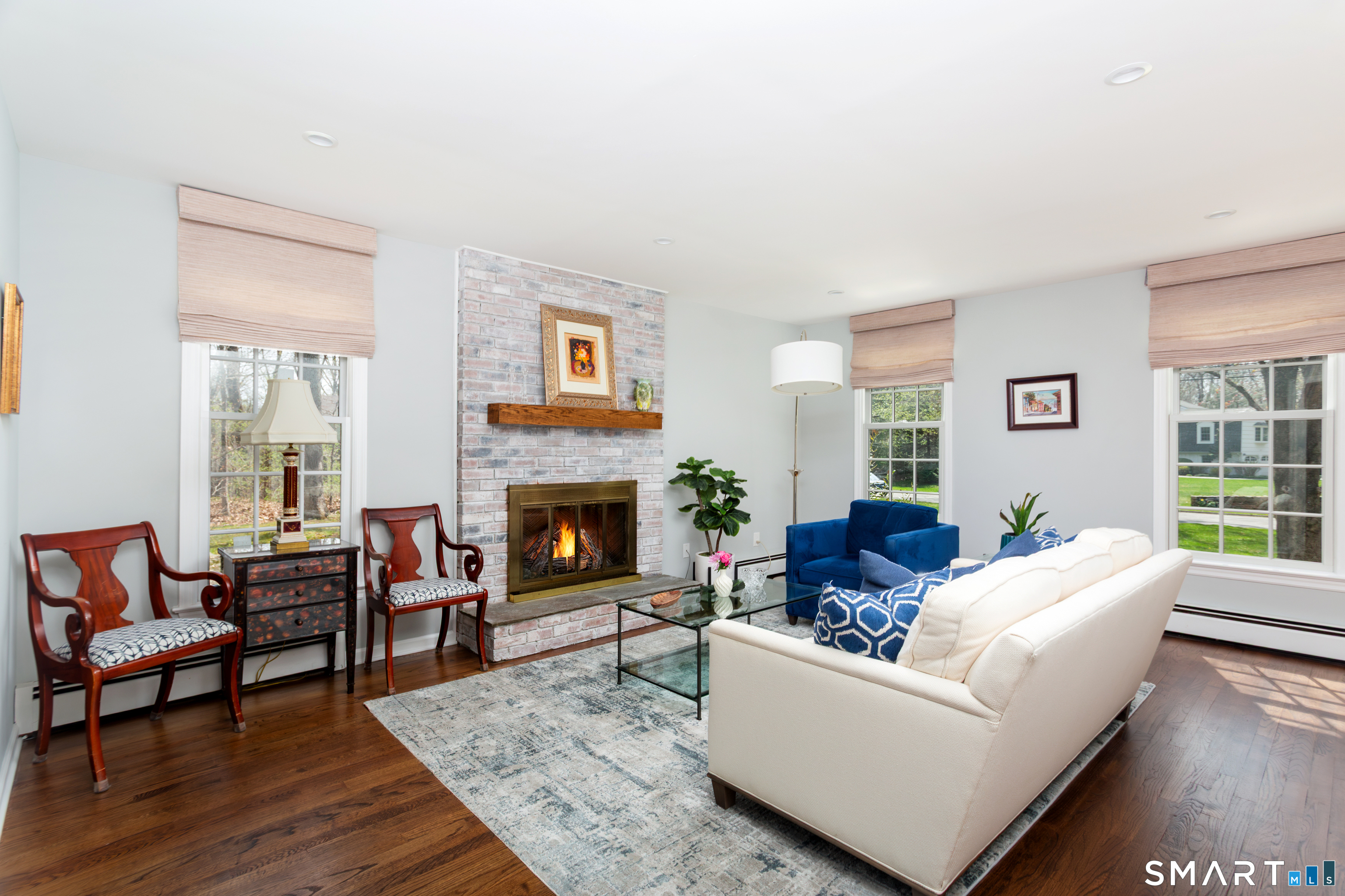 33 Cardinal Road Weston, CT 06883 - Photo 7 of 38 a living room with furniture and a fireplace