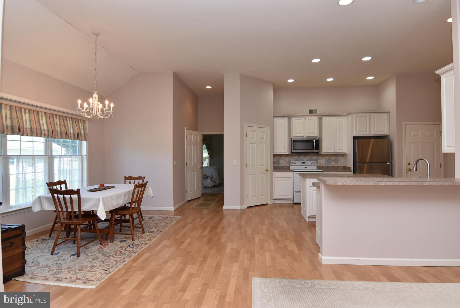 30849 Old Landing Road Laurel, DE 19956 - Photo 4 of 27 a view of a dining room with furniture and wooden floor