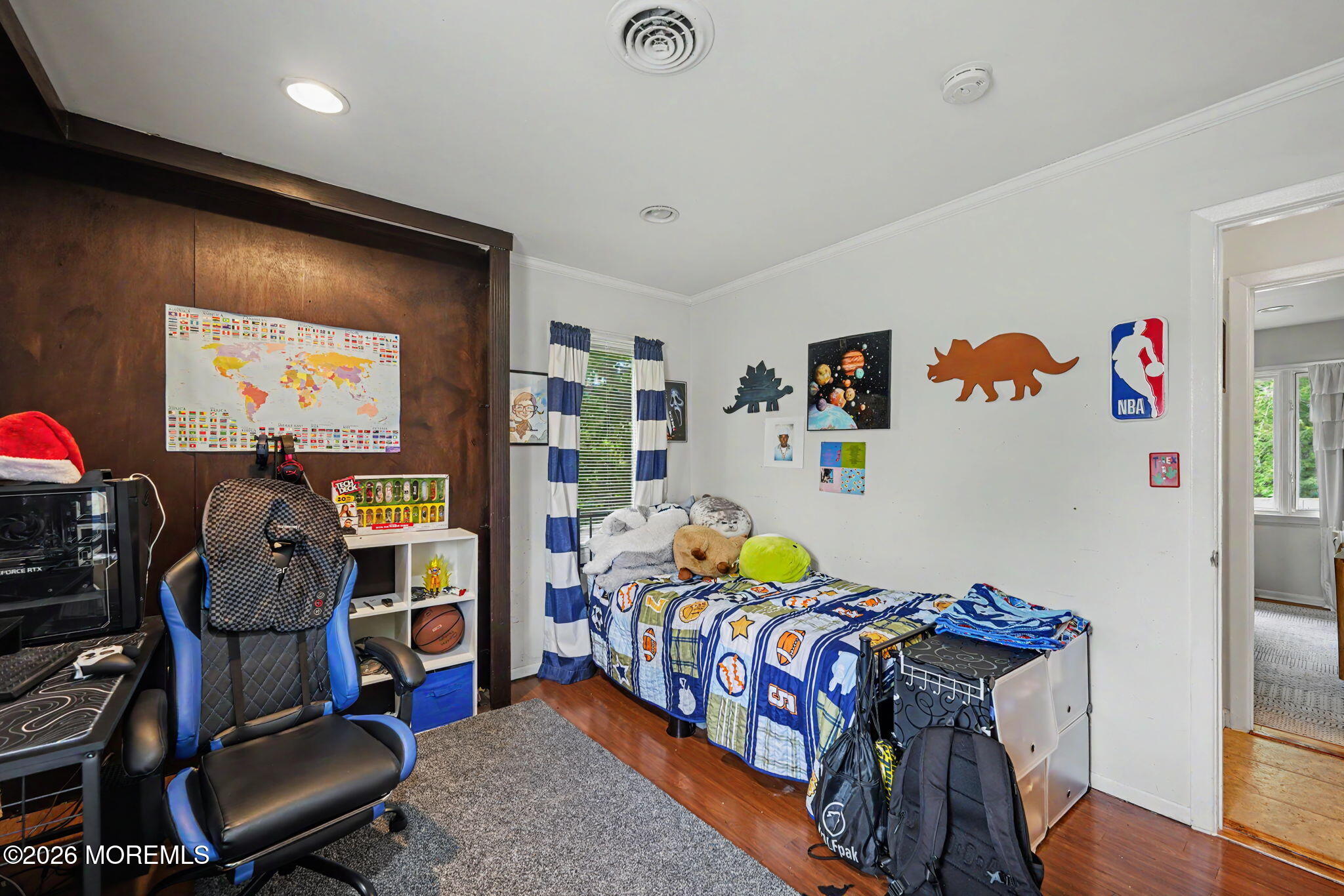 699 Aldrich Road Howell, NJ 07731 - Photo 18 of 30 a bedroom with a bed and a chandelier