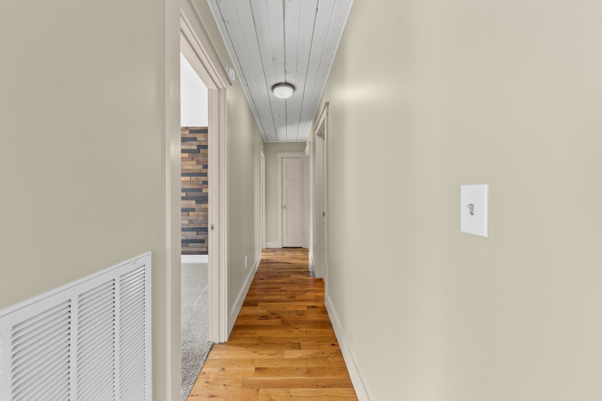 2191 Garner Road Mount Pleasant, TN 38474 - Photo 12 of 50 a view of a hallway with wooden floor and staircase