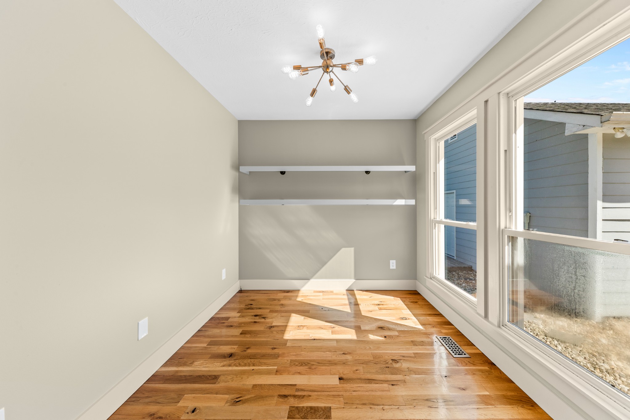 2191 Garner Road Mount Pleasant, TN 38474 - Photo 14 of 50 a view of a room with wooden floor and a ceiling fan