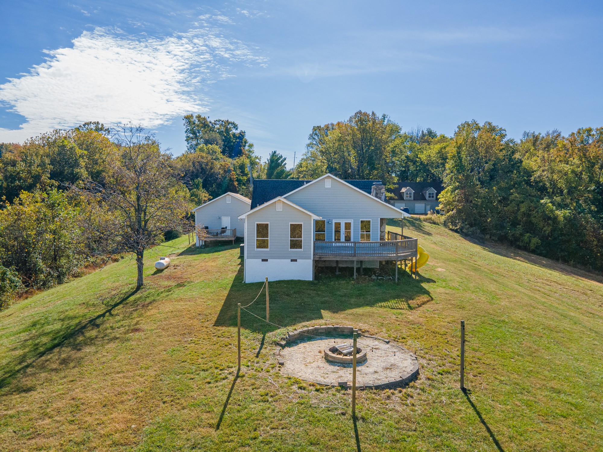 2191 Garner Road Mount Pleasant, TN 38474 - Photo 22 of 50 a front view of a house with swimming pool having outdoor seating