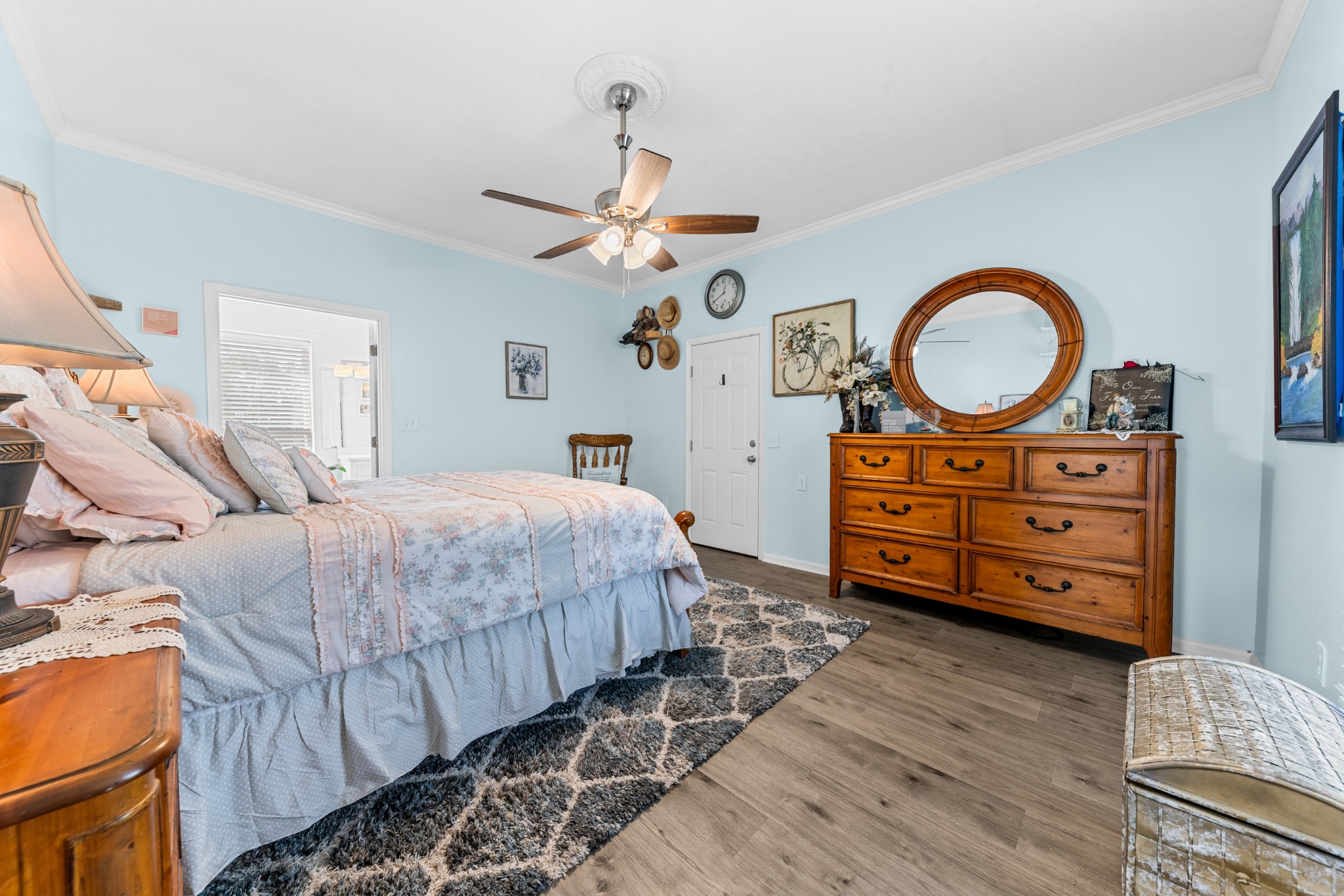 2191 Garner Road Mount Pleasant, TN 38474 - Photo 28 of 50 a bedroom with a bed a dresser and a chandelier