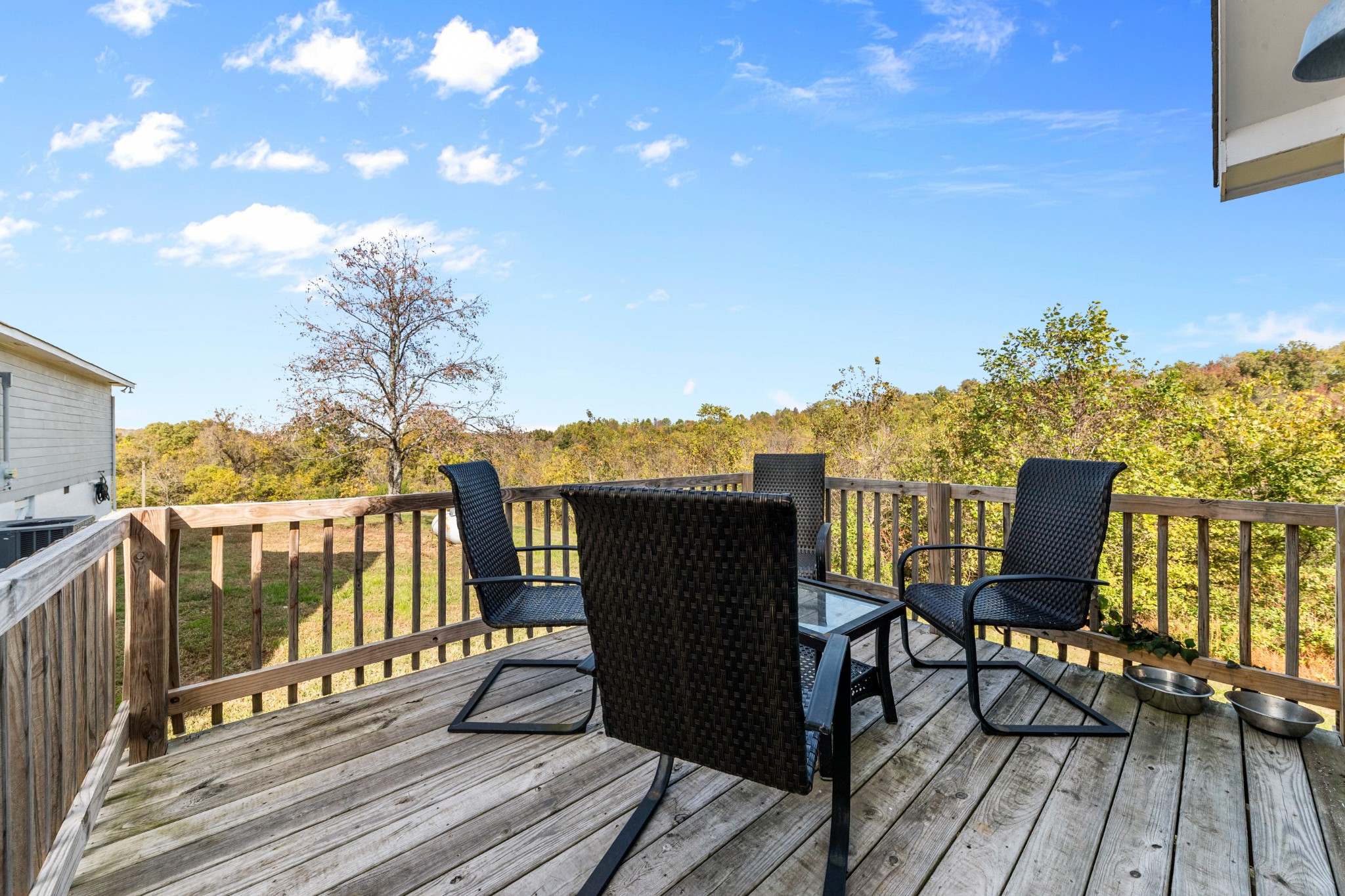 2191 Garner Road Mount Pleasant, TN 38474 - Photo 32 of 50 a view of a balcony with chairs and wooden floor