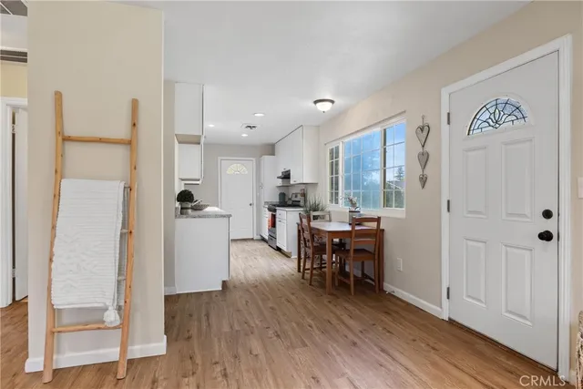 a view of a dining room with furniture window and wooden floor