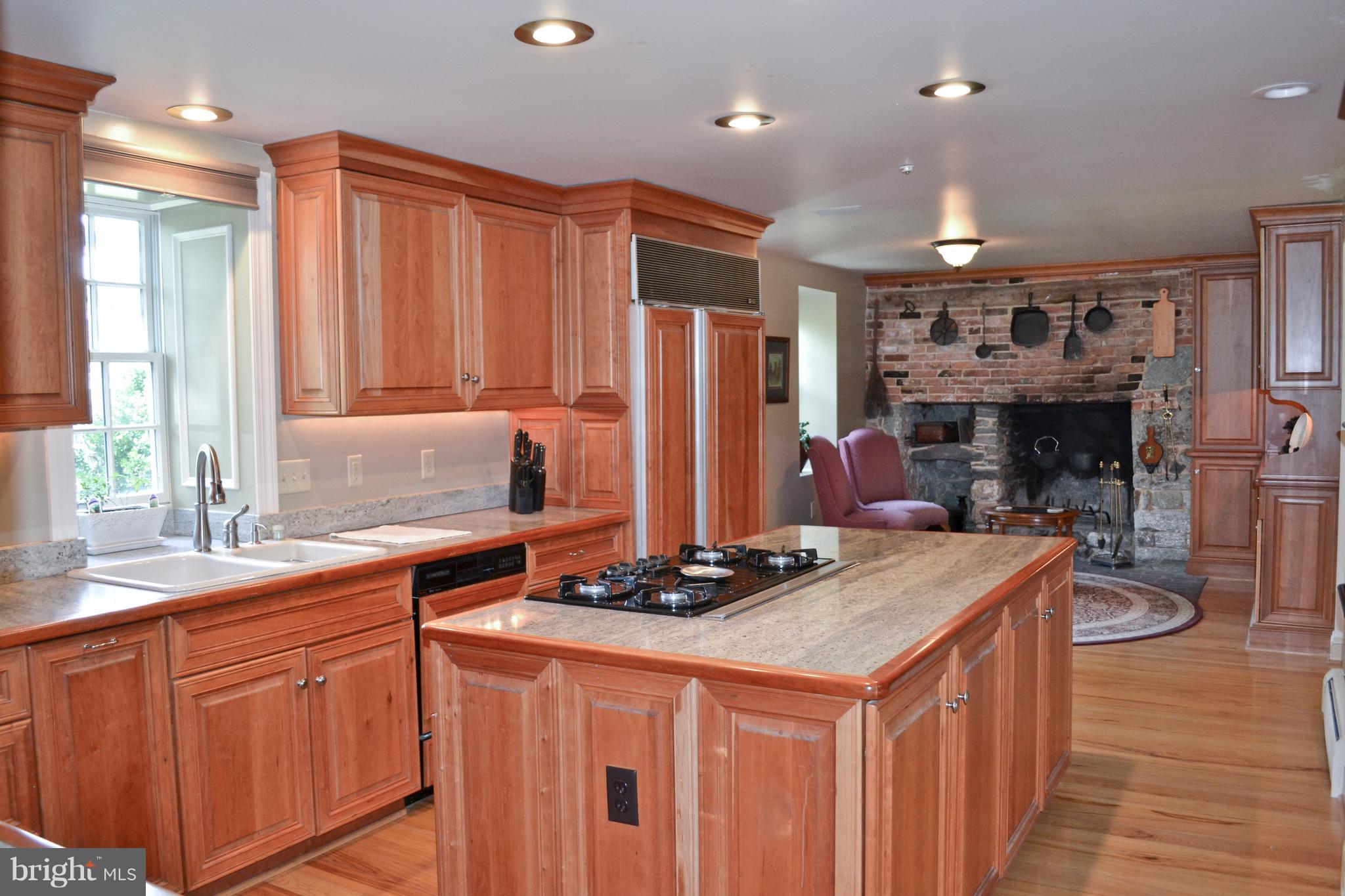 6415 Green Valley Road New Market, MD 21774 - Photo 18 of 98 Kitchen with brick fireplace and large island
