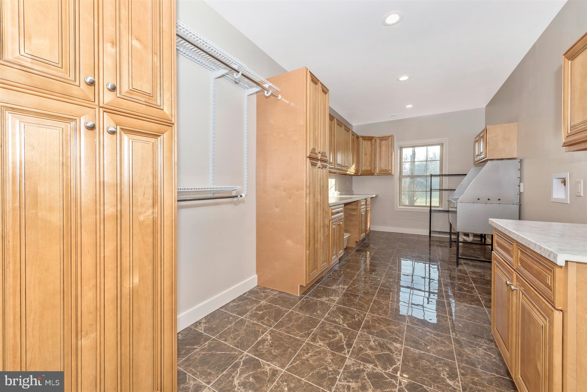 6415 Green Valley Road New Market, MD 21774 - Photo 29 of 98 Spacious laundry room with dog wash