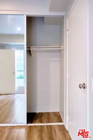 a view of room with wooden floor