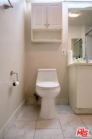 a bathroom with a toilet and a sink