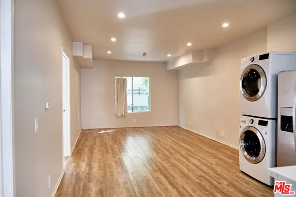 a view of a storage & utility room with wooden floor