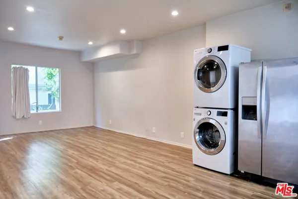 a view of a storage & utility room with wooden floor