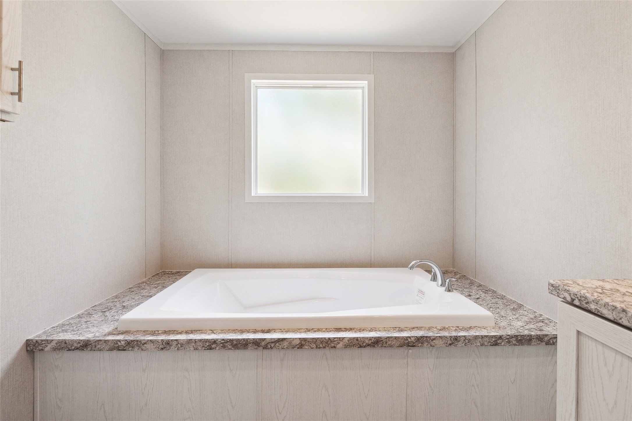 855 Roosevelt Road Kingsbury, TX 78638 - Photo 24 of 33 a bathroom with a granite countertop sink and tub