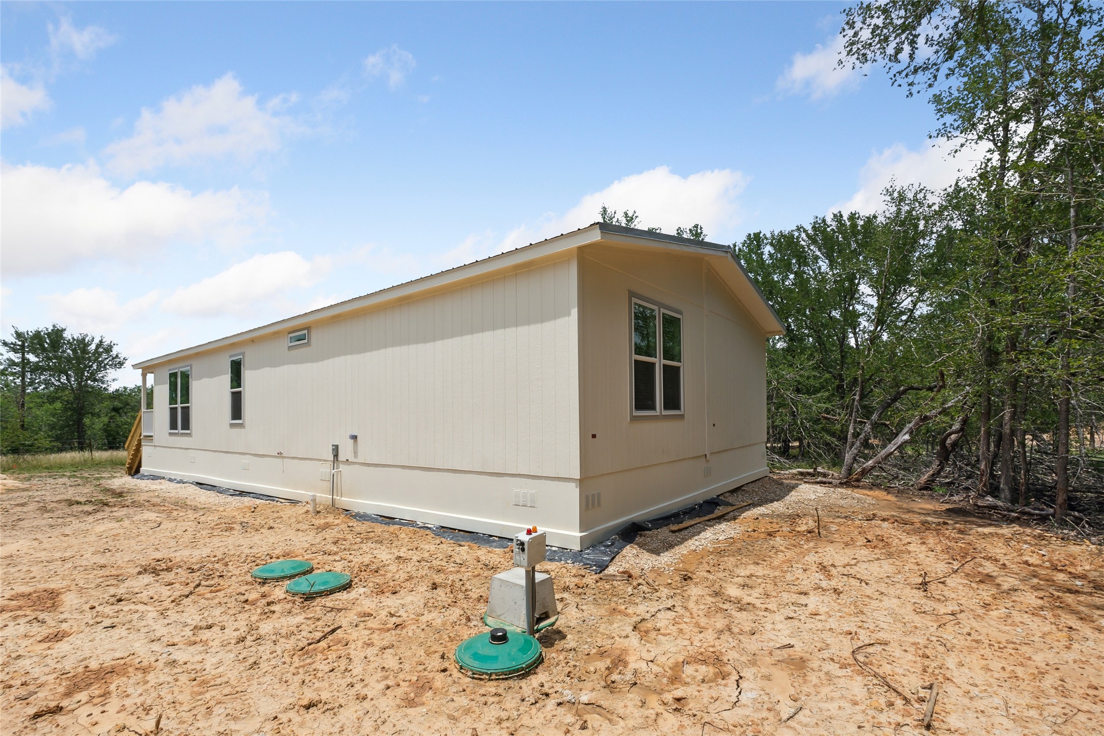 855 Roosevelt Road Kingsbury, TX 78638 - Photo 30 of 33 a front view of a house with a yard