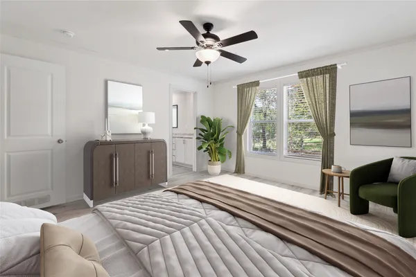 a bedroom with a large bed and a window