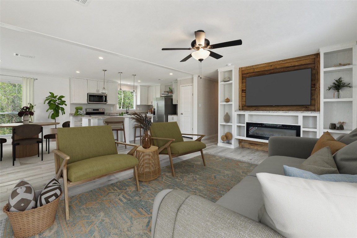 855 Roosevelt Road Kingsbury, TX 78638 - Photo 4 of 33 a living room with furniture and a flat screen tv