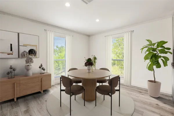 a living room with furniture potted plant and a window