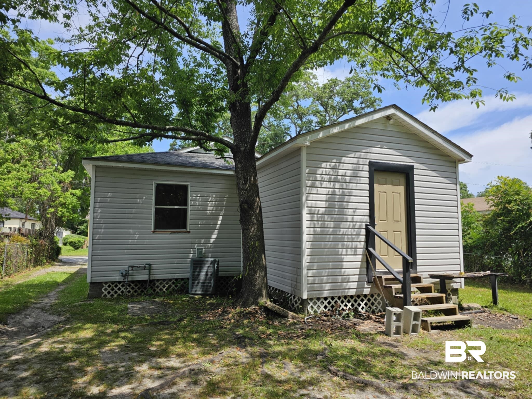 2253 Barlow Street Mobile, AL 36617 - Photo 9 of 10 Back of house with central AC unit, an outdoor structure, and entry steps