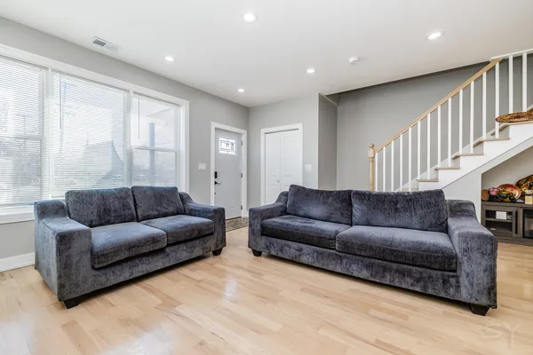 a kitchen with a white cabinets and sink