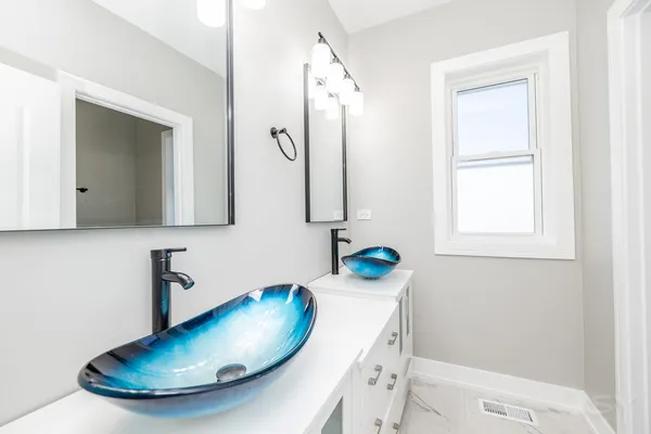 an empty room with wooden floor and window