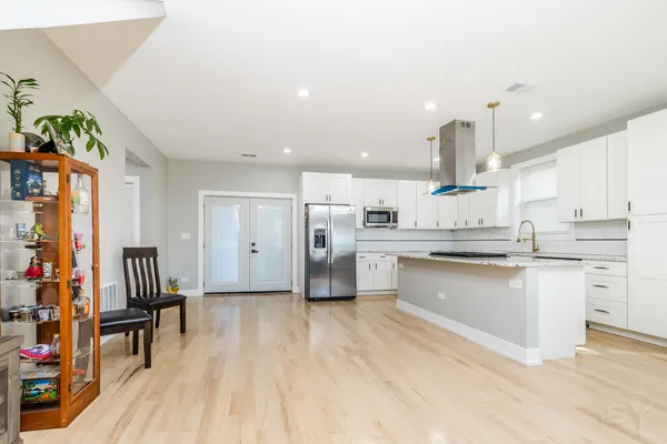 a view of a bathroom with a sink and mirror