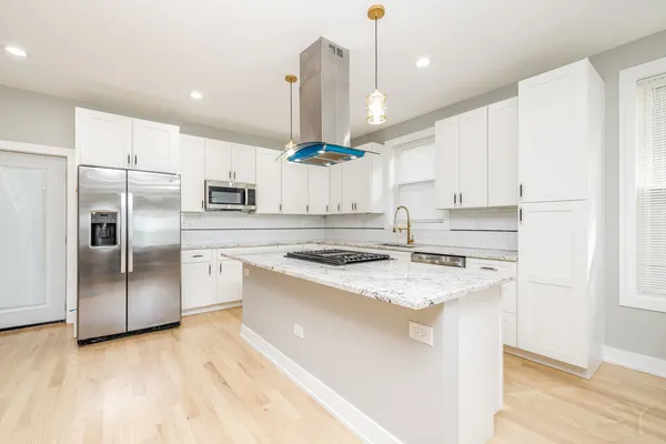 a bathroom with mirror and a sink