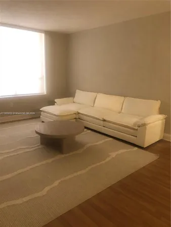 a living room with a couch and a table