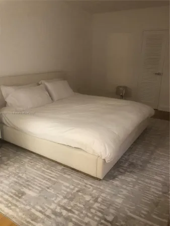 a close up of a bed in a room