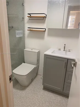 a bathroom with a toilet and a sink