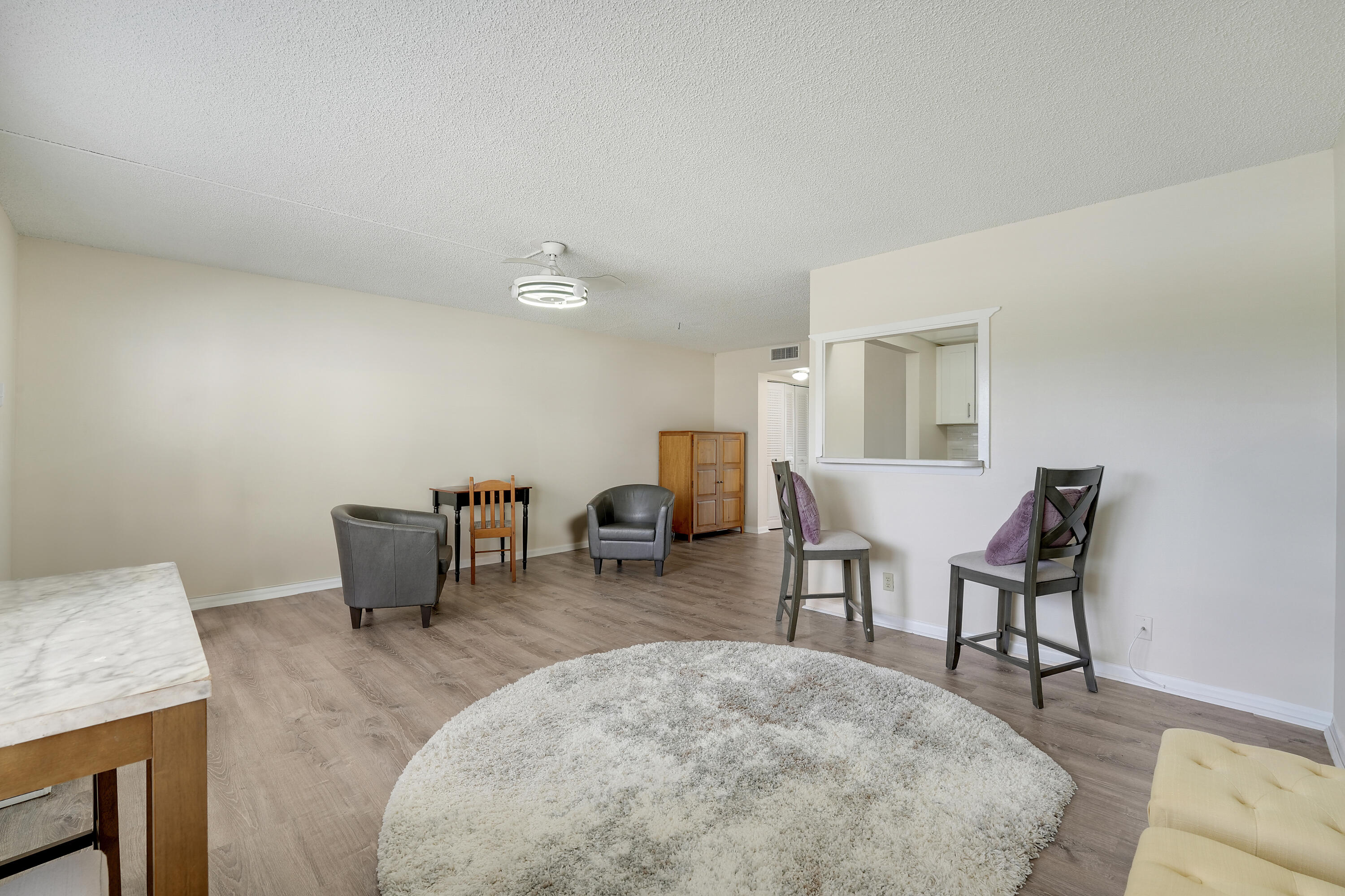 16 Mansfield B Boca Raton, FL 33434 - Photo 3 of 15 a living room with furniture and a couch