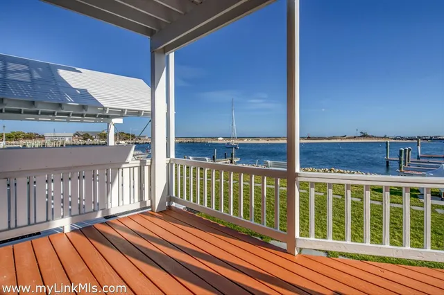 a view of a balcony with wooden floor