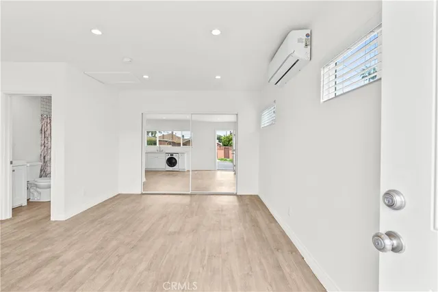a view of hallway with wooden floor