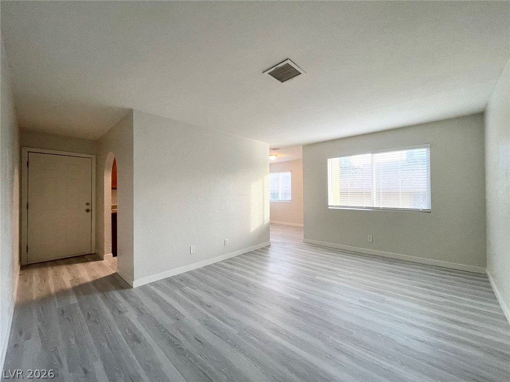 1834 North Decatur Boulevard, Unit 204 Las Vegas, NV 89108 - Photo 12 of 17 A spacious living area with sleek, light gray flooring, ready for your personalized touch.