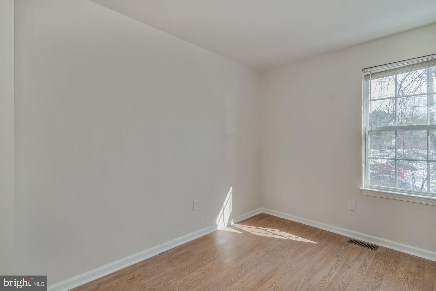 2704 Tall Pines Pine Hill, NJ 08021 - Photo 18 of 21 a view of an empty room with wooden floor and a window